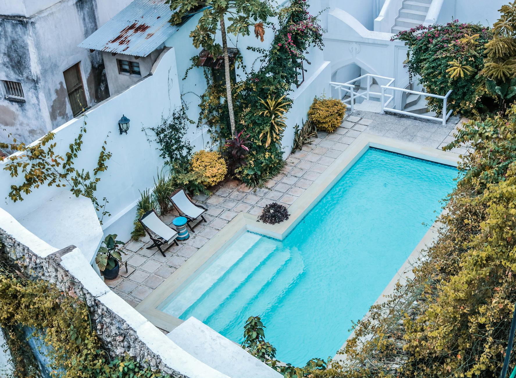 Solar panels powering a pool pump at a Caribbean villa with ocean view